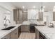 Contemporary kitchen featuring marble countertops, modern appliances, and sleek cabinetry, great for cooking at 12015 S Tuzigoot Dr, Phoenix, AZ 85044