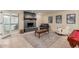 Open living room with a fireplace, neutral walls, and comfortable seating creating a welcoming space at 12015 S Tuzigoot Dr, Phoenix, AZ 85044