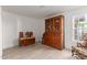 Charming living room with wooden floors, antique furniture, and natural light at 12015 S Tuzigoot Dr, Phoenix, AZ 85044
