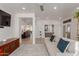 Comfortable living room with stylish furniture, open floor plan, and easy access to the kitchen and dining area at 12015 S Tuzigoot Dr, Phoenix, AZ 85044