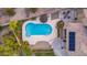 Backyard featuring a sparkling pool with patio furniture and lush desert landscaping at 12015 S Tuzigoot Dr, Phoenix, AZ 85044