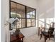 Inviting window nook featuring a large window, hardwood floors, and a comfortable chair at 12015 S Tuzigoot Dr, Phoenix, AZ 85044
