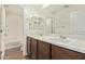 Bathroom with dual sink vanity and walk-in shower at 12041 W Fillmore St, Avondale, AZ 85323