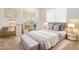 Cozy bedroom with plush carpets, gold accents, and bright, natural light at 12041 W Fillmore St, Avondale, AZ 85323