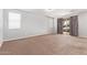 Neutral primary bedroom featuring carpeted floors and sliding glass doors at 12041 W Fillmore St, Avondale, AZ 85323