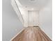 Light, bright home entryway with wood-look tile flooring, white trim, and natural light at 12041 W Fillmore St, Avondale, AZ 85323
