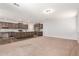 Open floor plan with kitchen featuring stainless appliances, island and pendant lights at 12041 W Fillmore St, Avondale, AZ 85323