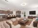 Open floor plan living room featuring a kitchen island and modern furnishings at 12041 W Fillmore St, Avondale, AZ 85323