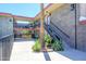 Exterior view of the condo building, with access stairs next to community pool at 1225 E Medlock Dr # 206, Phoenix, AZ 85014