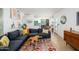 Open-concept living area with modern kitchen access and stylish decor at 1225 E Medlock Dr # 206, Phoenix, AZ 85014