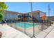 Exterior view featuring the community pool, lawn chairs, and condo building at 1225 E Medlock Dr # 206, Phoenix, AZ 85014