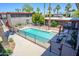 Aerial view of the community pool area featuring lounge chairs and landscaping at 1225 E Medlock Dr # 206, Phoenix, AZ 85014