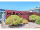 Signage for Mirada Luxury Condominiums with lush landscaping and rock groundcover at 1225 E Medlock Dr # 206, Phoenix, AZ 85014