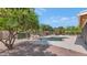 Resort-style backyard with a pool, a rock feature, and lush greenery for ultimate relaxation at 12730 N 90Th Way, Scottsdale, AZ 85260