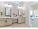 Elegant bathroom boasts dual sinks, modern fixtures, and a walk-in shower next to a soaking tub at 12730 N 90Th Way, Scottsdale, AZ 85260