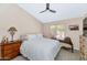 Inviting bedroom with a ceiling fan, a large bed, and stylish furniture for comfortable living at 12730 N 90Th Way, Scottsdale, AZ 85260