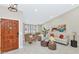 Inviting living room with comfortable seating, wood door, and a colorful painting that enhances the space at 12730 N 90Th Way, Scottsdale, AZ 85260