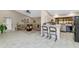 Inviting space with tile flooring, a glimpse into the living room and kitchen, promoting an open and airy feel at 12730 N 90Th Way, Scottsdale, AZ 85260
