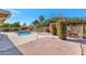 Backyard pool features mature trees and landscaping, providing a private outdoor oasis at 12730 N 90Th Way, Scottsdale, AZ 85260