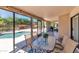 Sunroom showcases floor-to-ceiling windows with a pool view at 12730 N 90Th Way, Scottsdale, AZ 85260