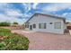 Large backyard with low maintenance desert landscaping, patio, and a partial view of the home's rear exterior at 13368 W Rimrock St, Surprise, AZ 85374