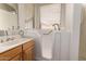 Bathroom with walk-in tub, wooden vanity, and natural light at 13368 W Rimrock St, Surprise, AZ 85374