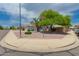 Street view showcases well-maintained landscaping and attractive curb appeal with lawn at 13368 W Rimrock St, Surprise, AZ 85374