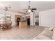View of the kitchen with appliances and breakfast nook with adjacent living room at 13368 W Rimrock St, Surprise, AZ 85374