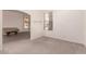 Inviting living room with ample natural light and neutral carpeting at 13368 W Rimrock St, Surprise, AZ 85374