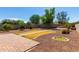 Backyard featuring a stone patio, a rock landscape, and a stone sidewalk path at 13602 N 149Th Ave, Surprise, AZ 85379