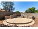 Backyard featuring a stone patio area and a rock landscape at 13602 N 149Th Ave, Surprise, AZ 85379