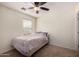 Bedroom featuring a ceiling fan and neutral carpet at 13602 N 149Th Ave, Surprise, AZ 85379