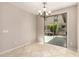 Bright dining room features tile floors and sliding glass doors leading to the patio at 13602 N 149Th Ave, Surprise, AZ 85379
