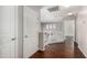 Upstairs hallway features wood floors and white banister at 13602 N 149Th Ave, Surprise, AZ 85379