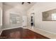 Bright living room featuring wood floors, neutral paint, and entry doorway at 13602 N 149Th Ave, Surprise, AZ 85379