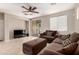 Inviting living room with a large sectional sofa, and modern entertainment system at 13602 N 149Th Ave, Surprise, AZ 85379