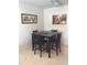 Cozy dining area featuring a dark wood table set for four, complemented by tasteful artwork at 14145 N 92Nd St # 2011, Scottsdale, AZ 85260