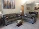 Bright living room with comfy gray couches, glass table, and dining set in view at 14145 N 92Nd St # 2011, Scottsdale, AZ 85260