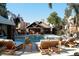 Beautiful swimming pool with plenty of lounge chairs and palm trees at 14145 N 92Nd St # 2011, Scottsdale, AZ 85260