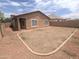 Expansive backyard ready for personalization, showcasing fresh landscaping with decorative rock and a patio at 14841 W Desert Hills Dr, Surprise, AZ 85379