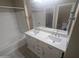Bright bathroom features a double sink vanity with a tub-shower combo at 14841 W Desert Hills Dr, Surprise, AZ 85379