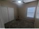 Bedroom features carpet, a window, and a closet with sliding doors at 14841 W Desert Hills Dr, Surprise, AZ 85379