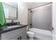 Bathroom with modern black hardware, gray cabinets, tile backsplash, and stylish design at 16 W Encanto Blvd # 110, Phoenix, AZ 85003