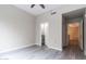 Bright bedroom featuring hardwood floors and a ceiling fan, plus multiple closets at 16 W Encanto Blvd # 110, Phoenix, AZ 85003