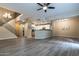 Spacious open-concept living area showcasing a modern kitchen and a staircase to the upper level at 16 W Encanto Blvd # 110, Phoenix, AZ 85003