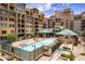 Beautiful community pool area with lounge chairs, cabana, and well-maintained landscaping at 16 W Encanto Blvd # 110, Phoenix, AZ 85003