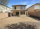 Expansive backyard with a patio area, providing an ideal space for outdoor dining and entertaining guests at 18148 W Lundberg St, Surprise, AZ 85388