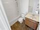 Bright bathroom featuring a shower-tub combo and vanity at 18148 W Lundberg St, Surprise, AZ 85388