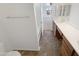 Bathroom featuring tile floors, dual sinks, vanity, and a shower tub combo at 18148 W Lundberg St, Surprise, AZ 85388