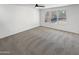 Large bedroom with a ceiling fan, providing natural light and comfort at 18148 W Lundberg St, Surprise, AZ 85388
